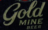 Фирменная бутылка пива Gold Mine Beer