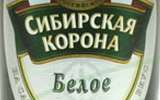 Знаменитая рельефная бутылка пива Сибирская корона Белое - фото