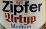 Фирменная бутылка и бокал австрийского пива Zipfer Urtyp Medium