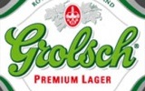 Фирменная бутылка пива и стакан Grolsch Premium Lager